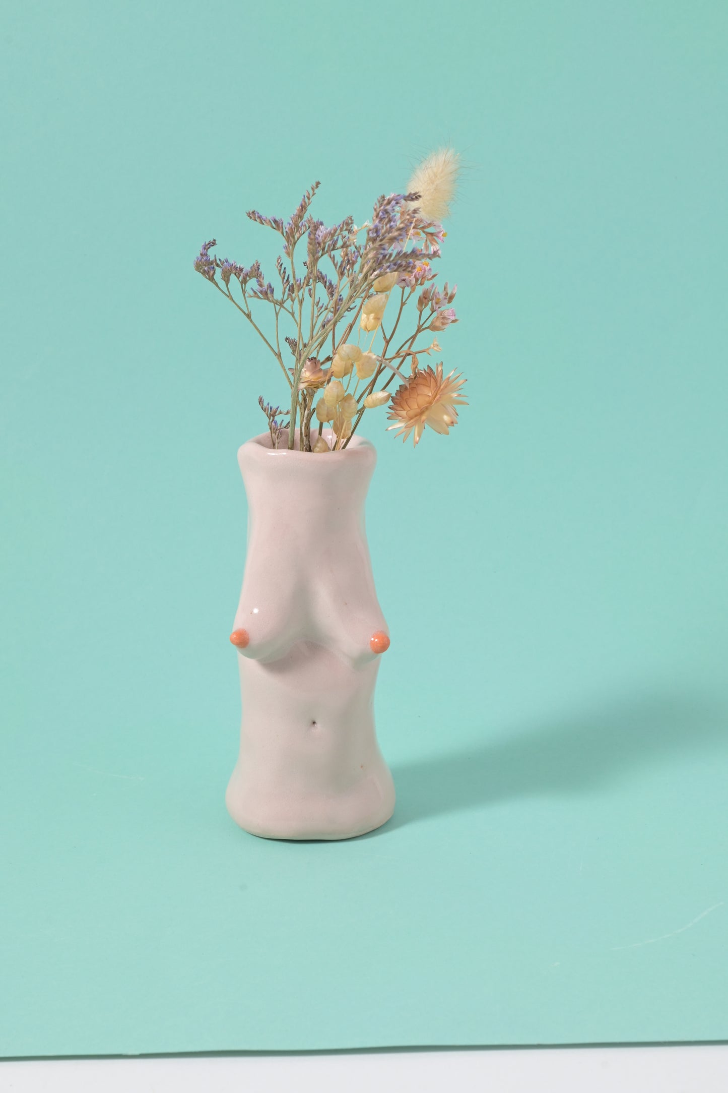 Candle , vase + tits